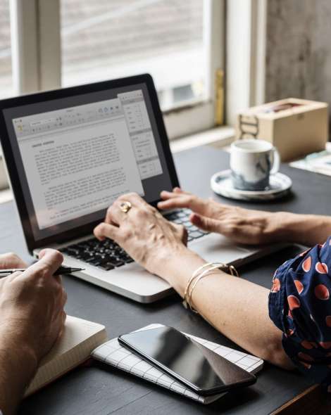 Woman Working on Laptop Typing Essay Information